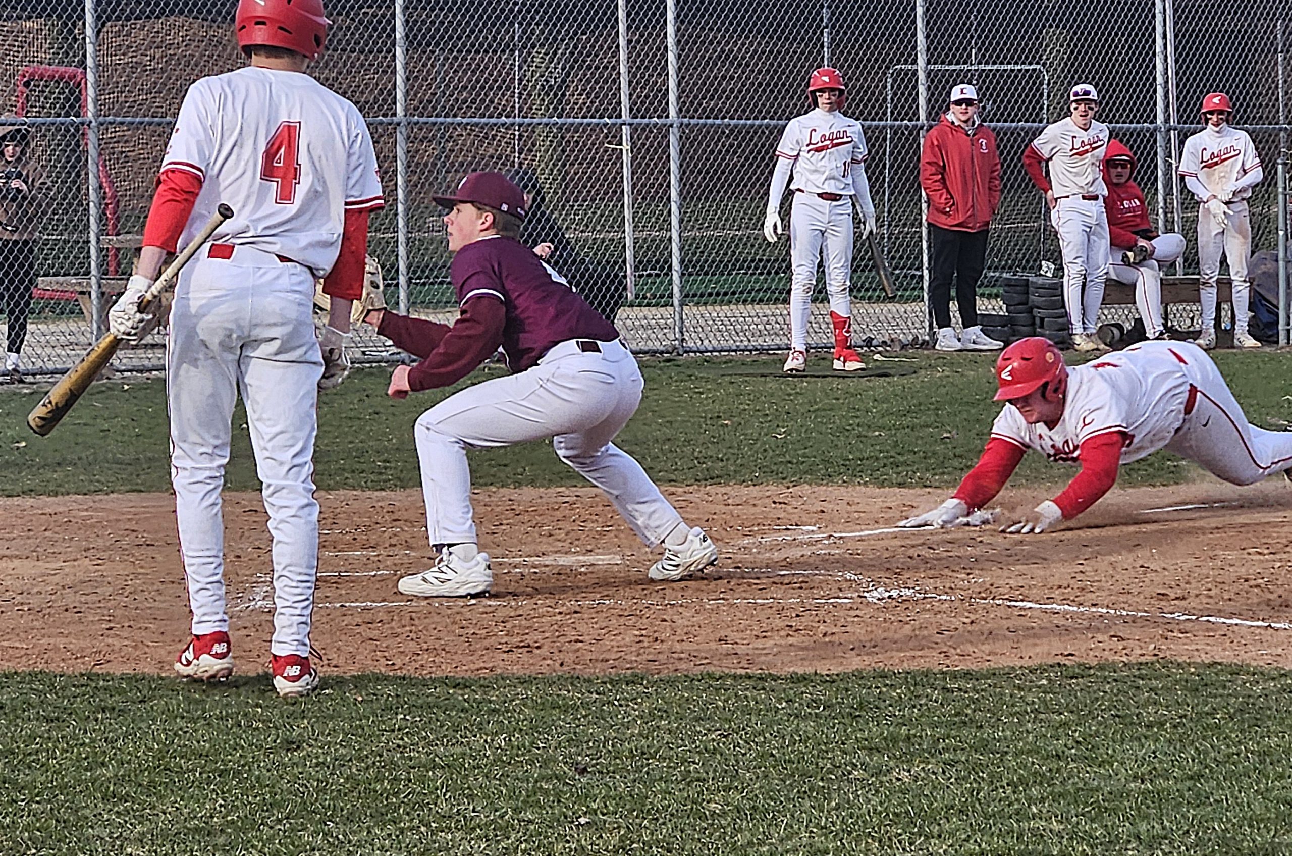 Logan's Owen Check goes into his slide while scoring what became the winning run in a 2-1 baseball victory over Prairie du Chien. -- TODD SOMMERFELDT PHOTO