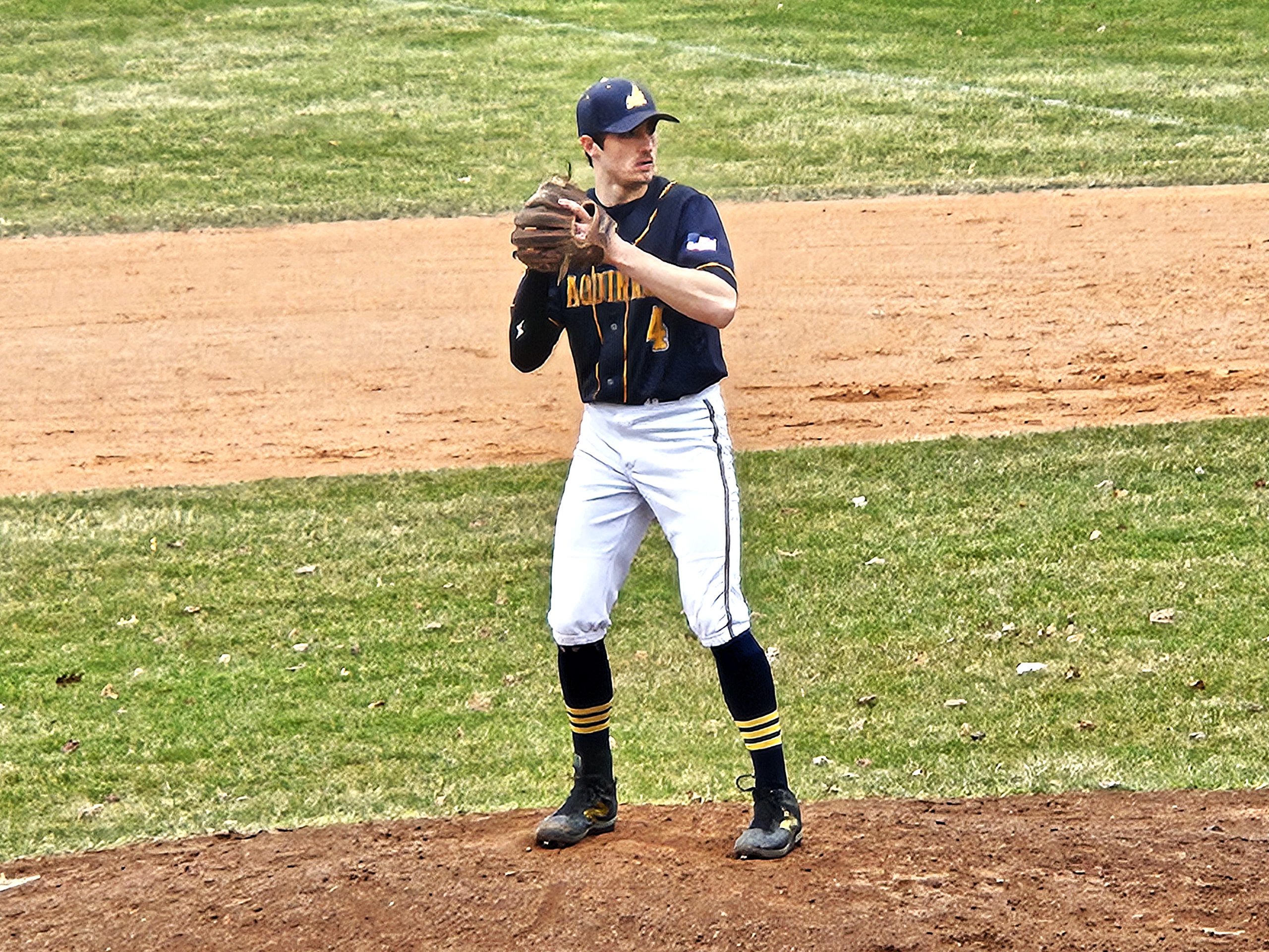 Aquinas senior Waylon Hargrove starts his pitch during Wednesday's game at Onalaska. Hargrove pitched six scoreless innings. -- TODD SOMMERFELDT PHOTO
