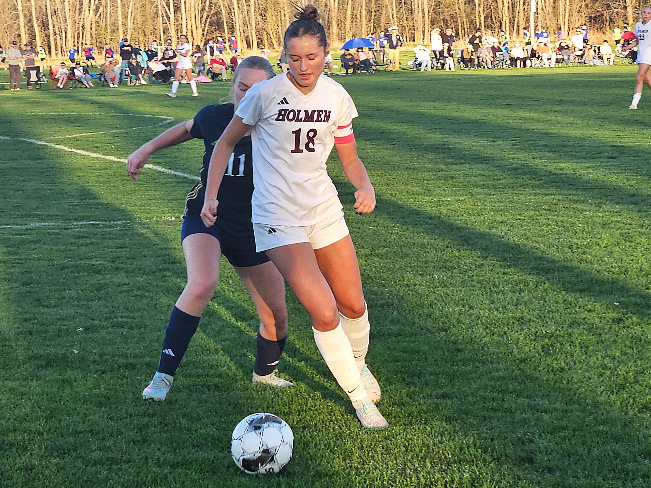 Holmen's Jocelyn Williams controls the soccer ball against Aquinas' Liv Dickinson during the Vikings' 4-0 MVC victory. -- TODD SOMMERFELDT PHOTO