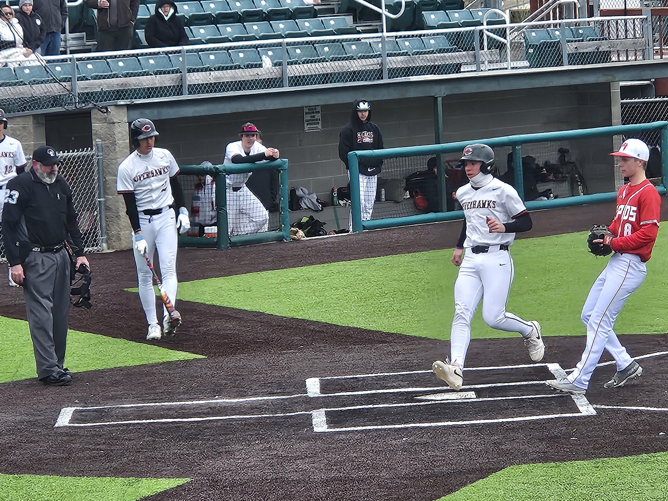 Central catcher Charlie Buxton scores one of his team's 18 runs in a doubleheaders sweep of Wisconsin Rapids at Copeland Park on Saturday. -- TODD SOMMERFELDT PHOTO
