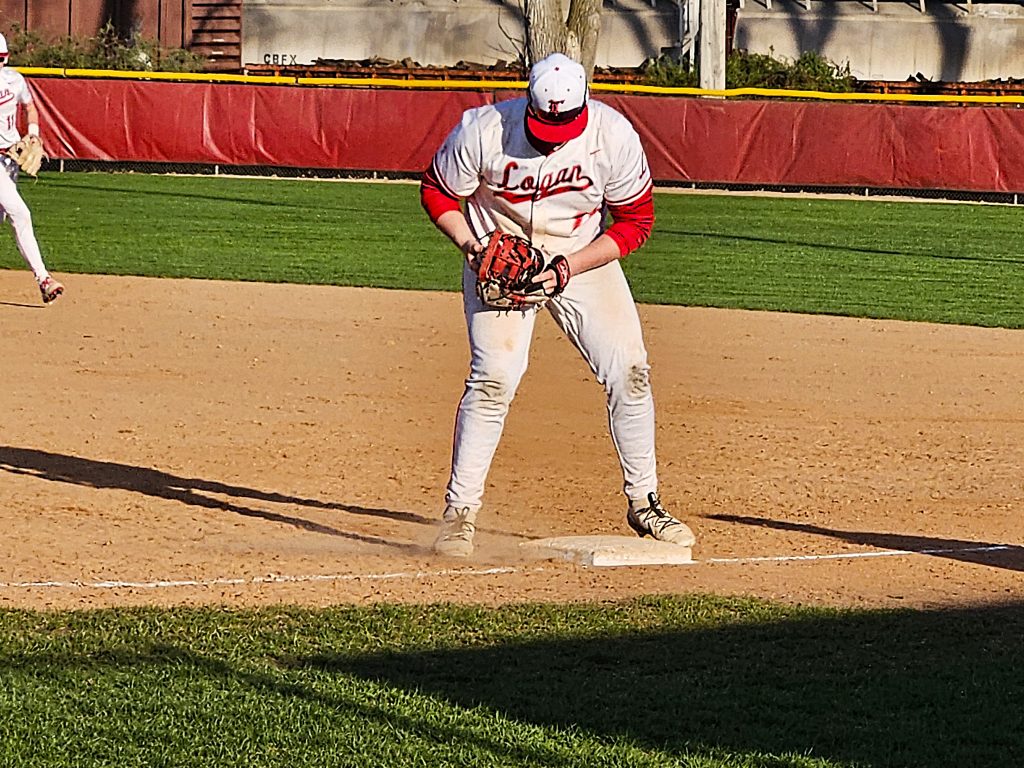 Logan's Owen Check completes an out at first base during Monday's game against Central. -- TODD SOMMERFELDT PHOTO