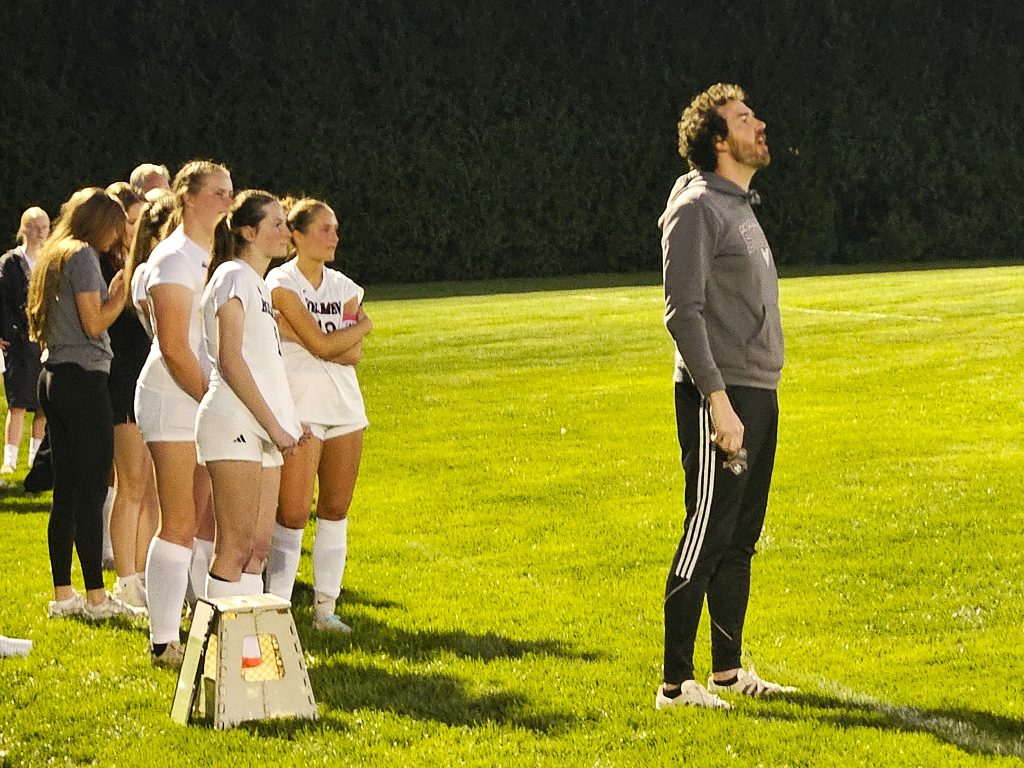 Holmen girls soccer coach Nick Schellenger shouts instructions to his team as his players watch the actin against West Salem. -- TODD SOMMERFELDT PHOTO