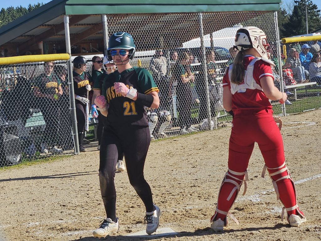Melrose-Mindoro's Kelsey Young scores an early run in what became a 5-4 nonconference softball victory over Westby on Friday. -- TODD SOMMERFELDT PHOTO