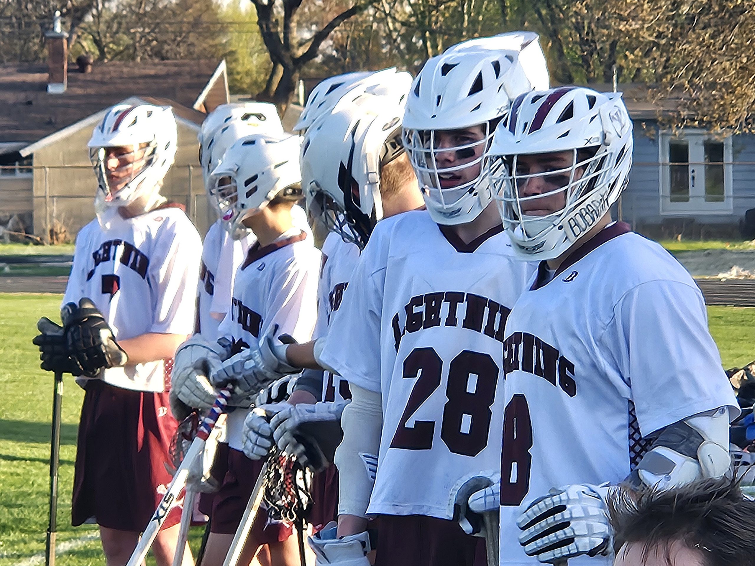 Members of the La Crosse co-op boys lacrosse team watch the action during a game at Central High School this season. -- TODD SOMMERFELDT PHOTO