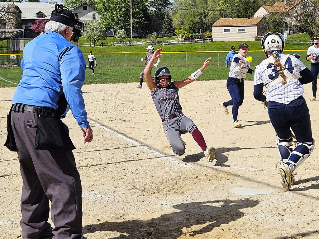 Holmen senor Macy Kline slides as River Falls tries to get the ball home during Friday's doubleheader at Viking Elementary. -- TODD SOMMERFELDT PHOTO