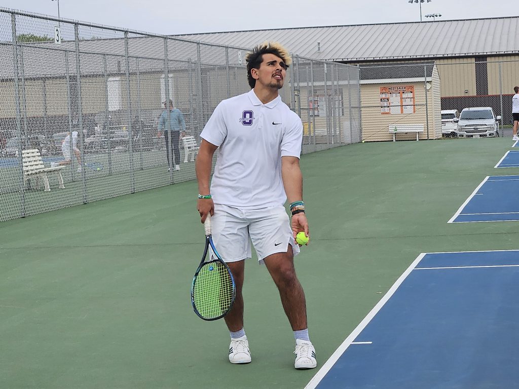 Onalaska's Elijah Fernandes tosses for serve during his No. 4 singles match against West Salem on Monday. -- TODD SOMMERFELDT PHOTO