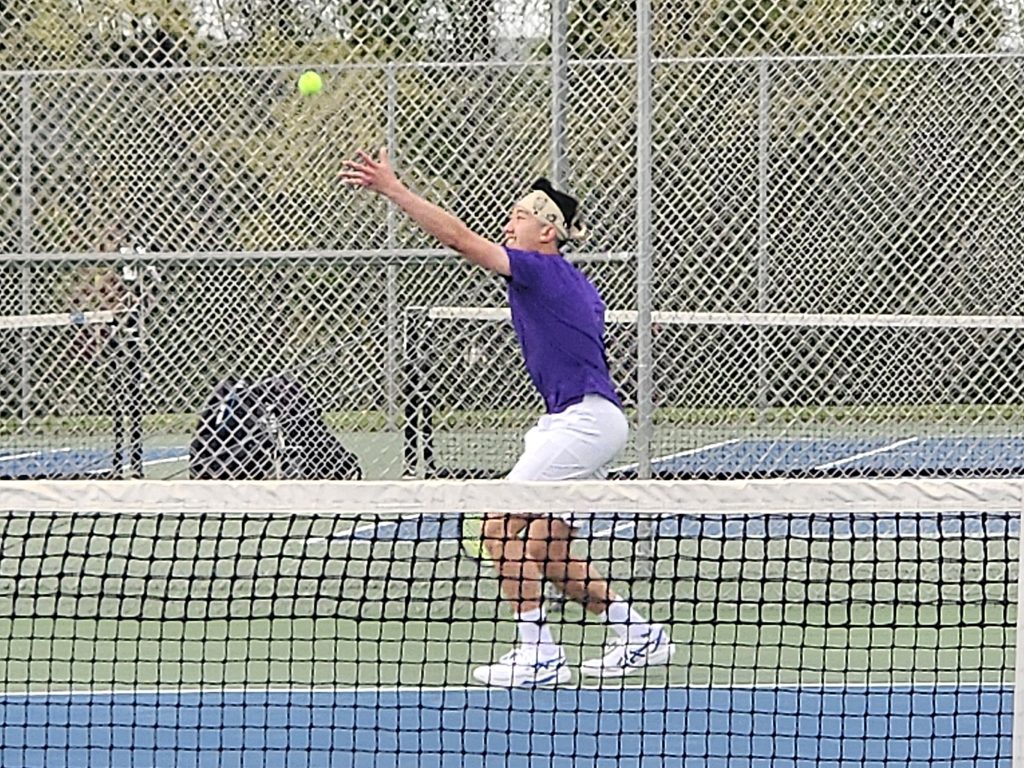 Onalaska's Lewis Go serves during the No 1 singles match of a dual meet against West Salem on Monday. -- TODD SOMMERFELDT PHOTO