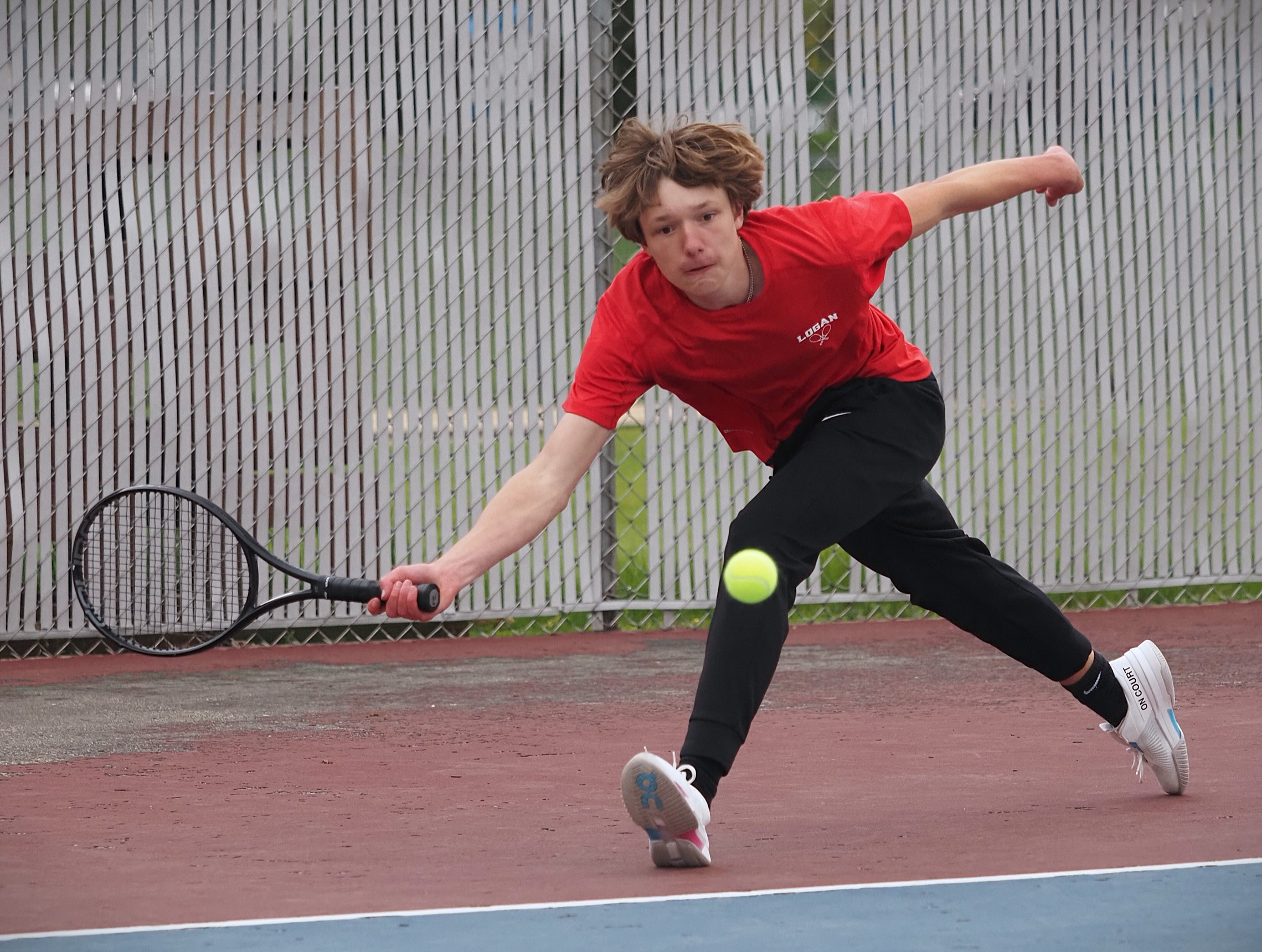 Logan vs. Holmen boys tennis. -- TARA WALTERS PHOTO