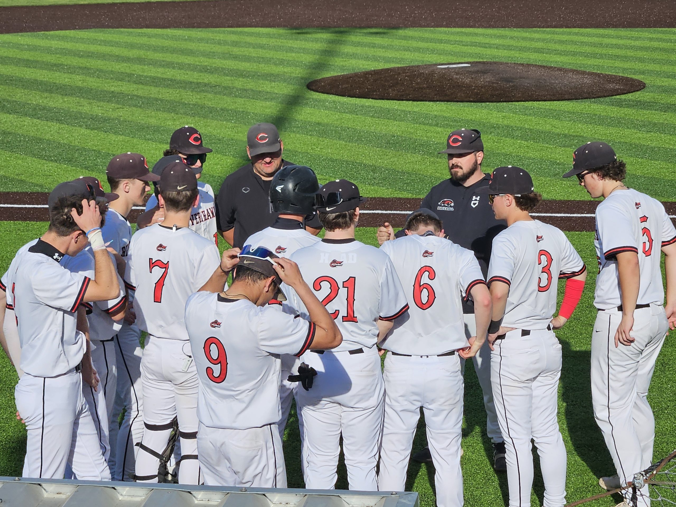 Central baseball coach Garrett Grosch talks to his team between games of a doubleheader at Copeland Park. -- TODD SOMMERFELDT PHOTO