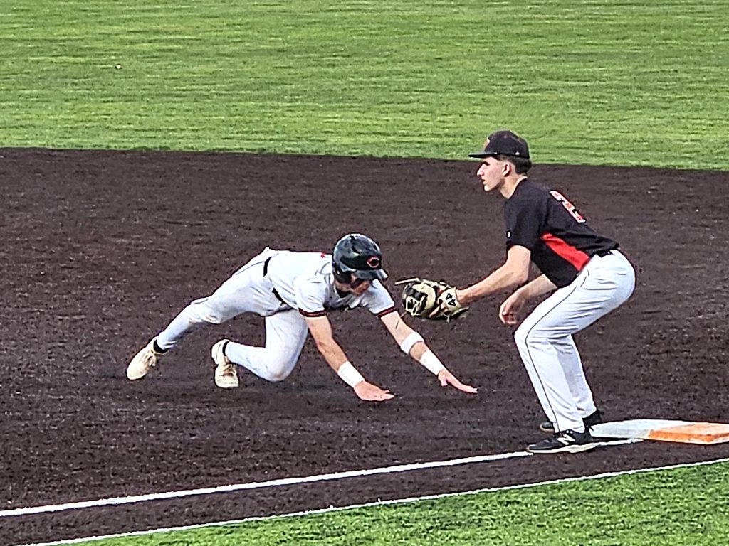 Central's Charlie Buxton gets back to first base ahead of a pickoff throw in a game against Stevens Point. -- TODD SOMMERFELDT PHOTO