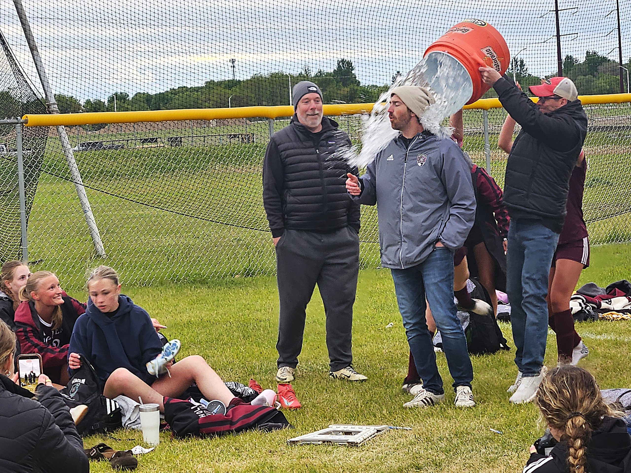 Holmen girls soccer coach Nick Schellenger is doused mid-speech after the Vikings won their first MVC championship on Tuesday. -- TODD SOMMERFELDT PHOTO