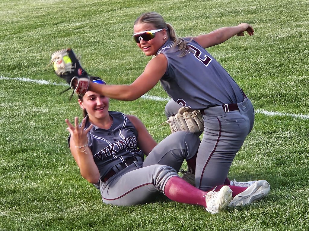 Holmen shortstop Macy Kline makes the catch during a collision with left fielder Sydney Cichosz during the seventh inning of a 4-0 Division 1 regional championship win over Onalaska. -- TODD SOMMERFELDT PHOTO