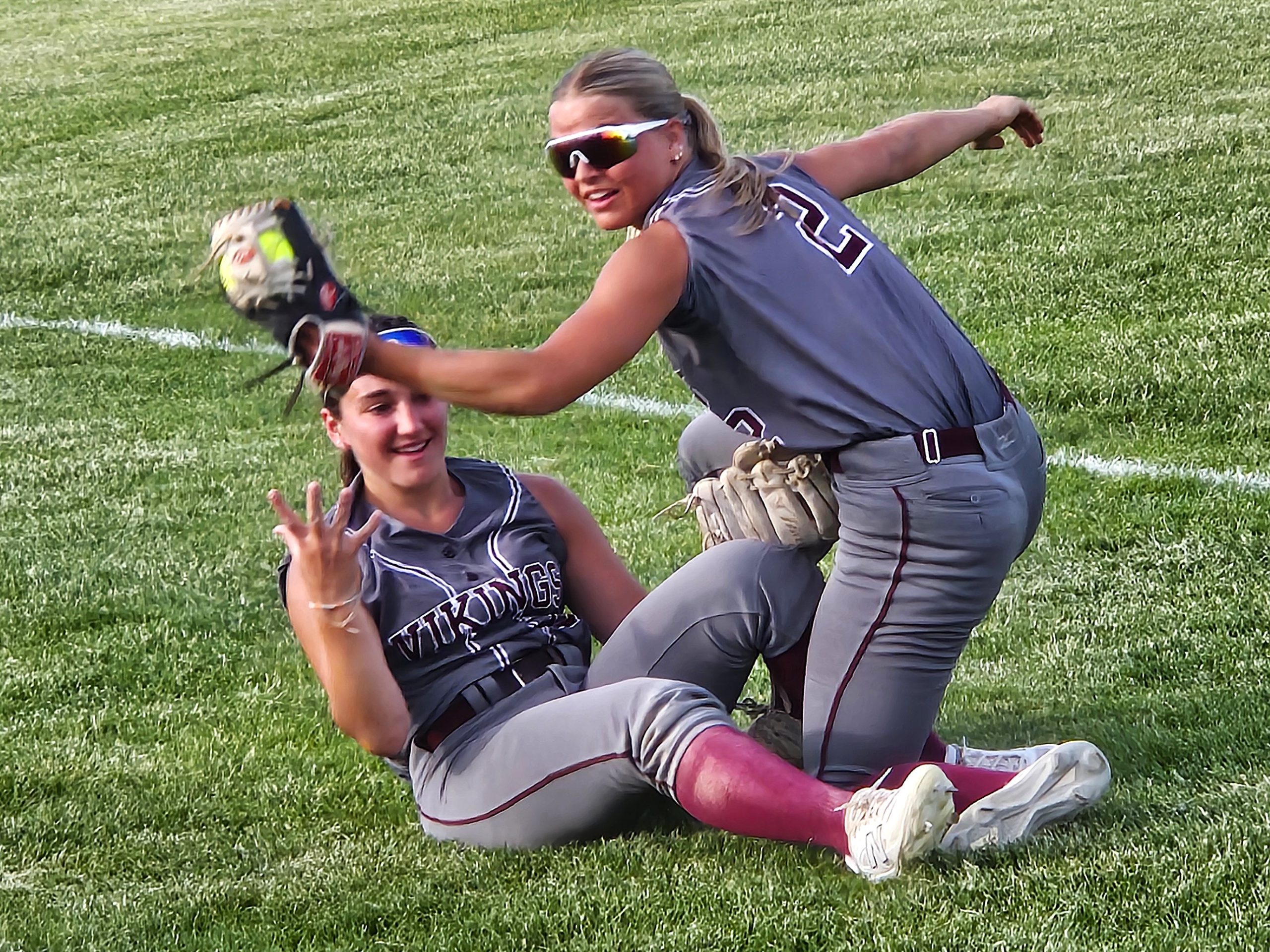 Holmen shortstop Macy Kline makes the catch during a collision with left fielder Sydney Cichosz during the seventh inning of a 4-0 Division 1 regional championship win over Onalaska. -- TODD SOMMERFELDT PHOTO