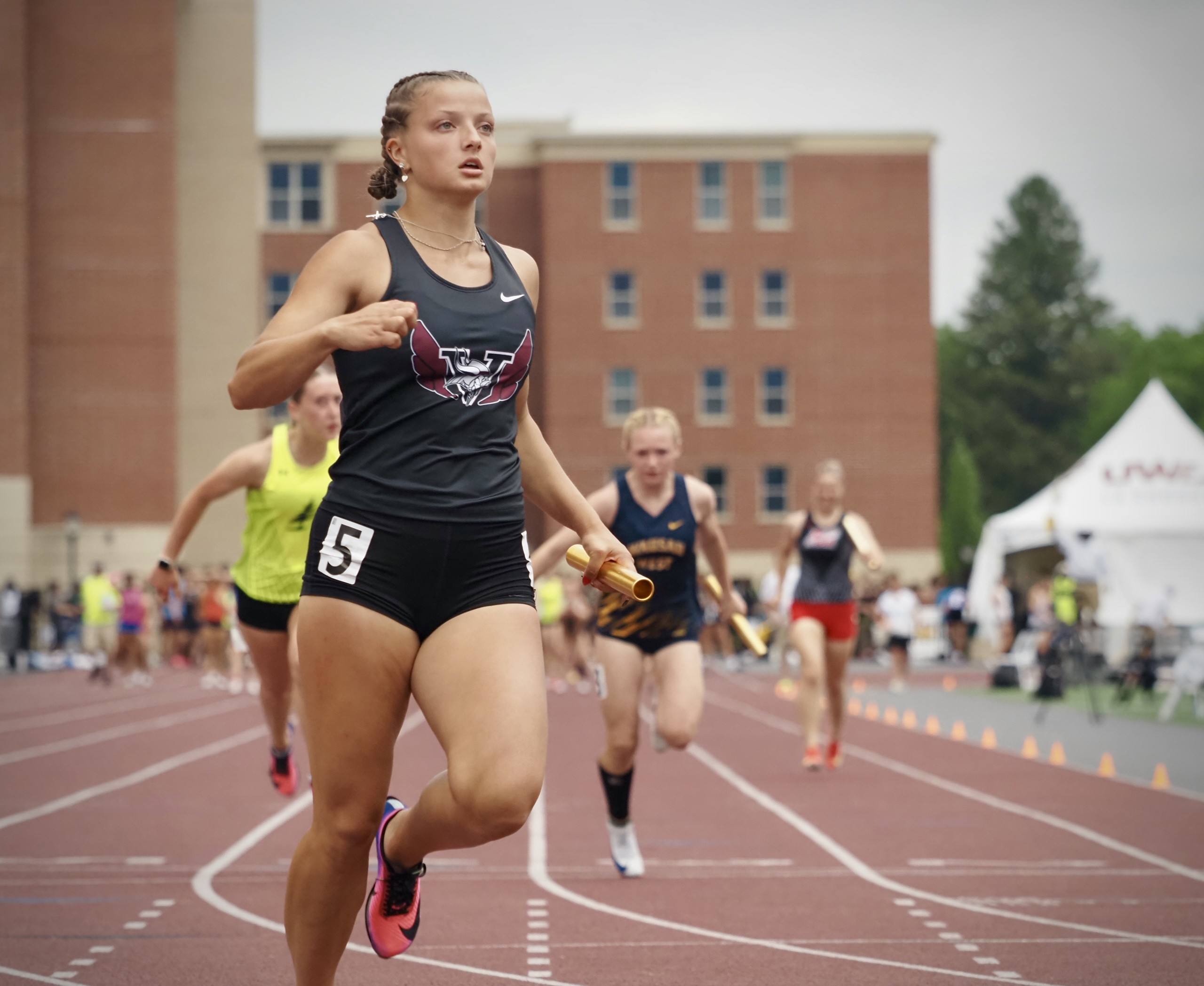 Holmen senior Lydia Lazarescu completes her 400 relay team's run during the WIAA state track and field meet on Friday. -- TARA WALTERS PHJOTO