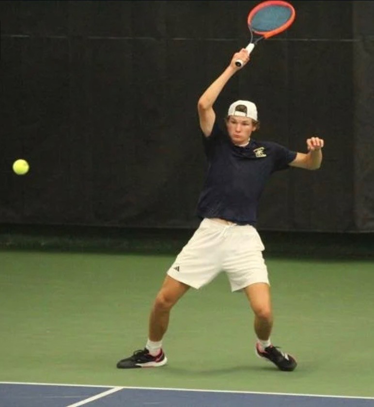 Aquinas senior Tegan Schott returns a shot during Friday's action at the WIAA Division 2 state boys tennis tournament. -- SUBMITTED PHOTO