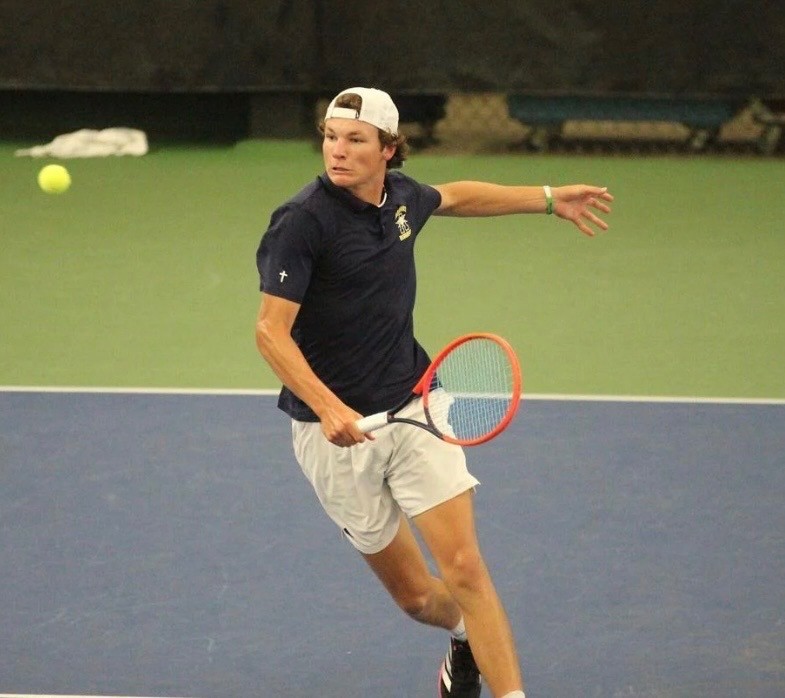 Aquinas senior Tegan Schott returns a shot during Friday's action at the WIAA Division 2 state boys tennis tournament. -- SUBMITTED PHOTO