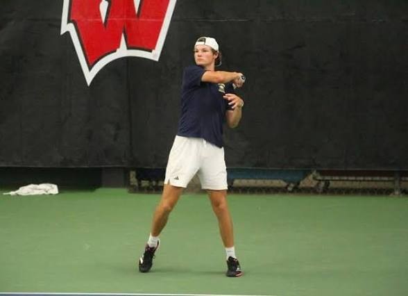 Aquinas senior Tegan Schott returns a shot during Friday's action at the WIAA Division 2 state boys tennis tournament. -- SUBMITTED PHOTO