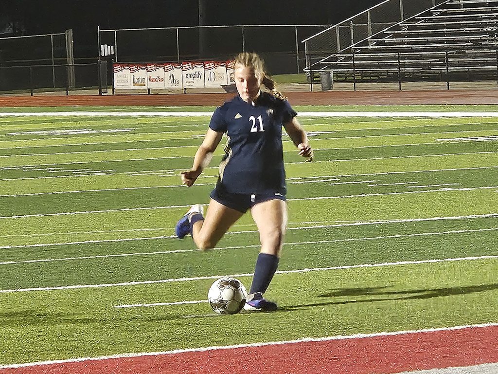 Aquinas sophomore Hannah Miller takes her PK in what became the winning goal in a WIAA Division 4 sectional semifinal victory over Lodi on Thursday. -- TODD SOMMERFELDT PHOTO
