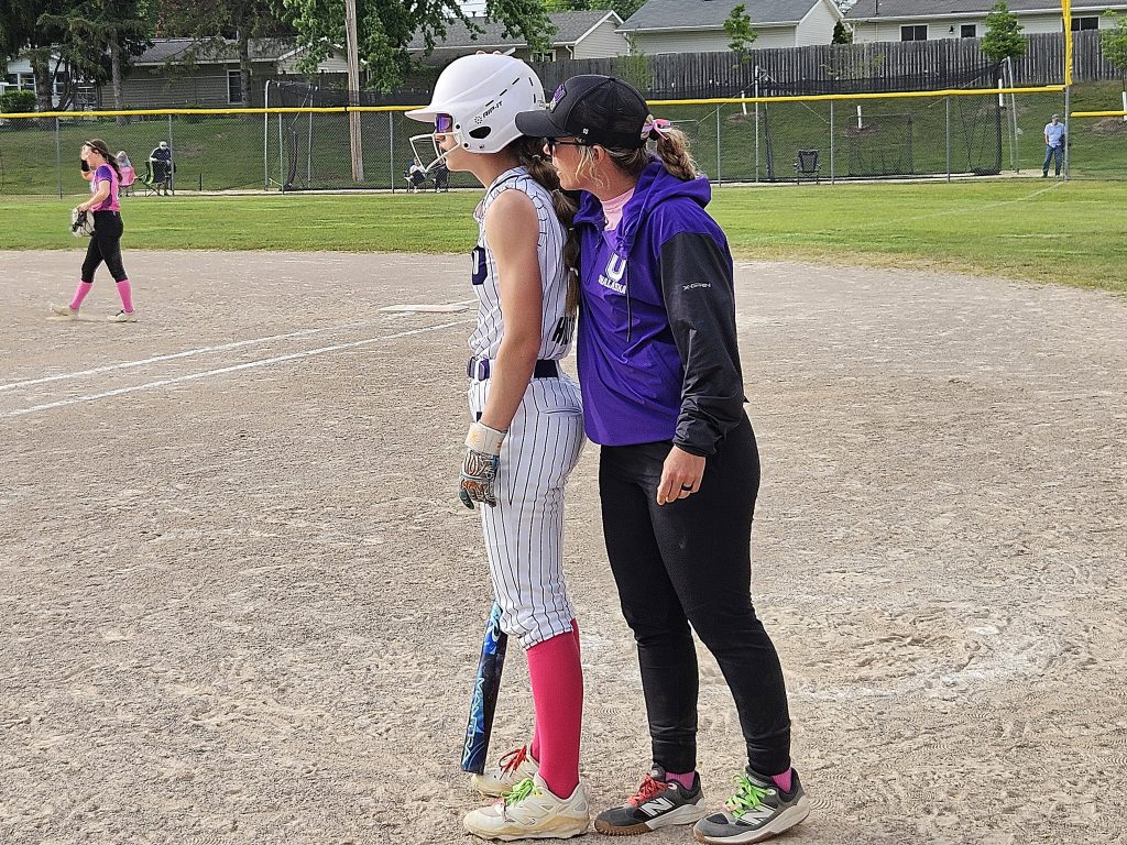 Onalaska softball coach Mesa Heit talks to her daughter MJ before an at-bat. -- TODD SOMMERFELDT PHOTO