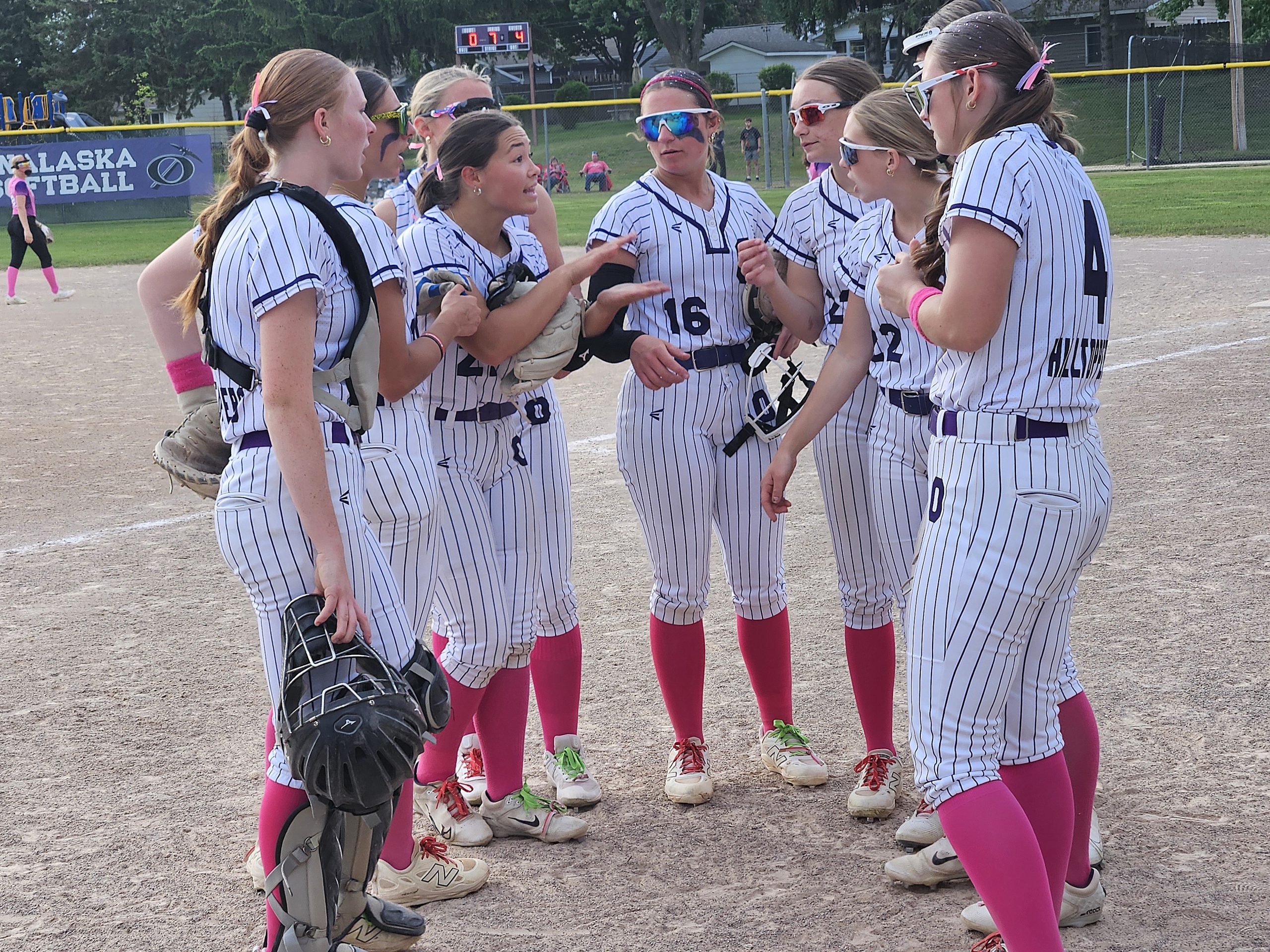 The Onalaska softball team has a quick chat between innings of a game this spring. -- TODD SOMMERFELDT PHOTO