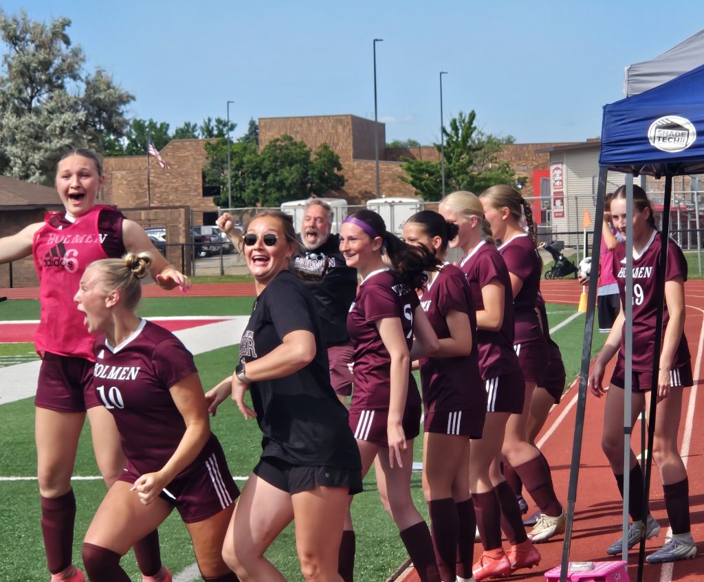 Holmen soccer players react as time expires and they become WIAA Division 2 sectional champions. -- TODD SOMMERFELDT PHOTO