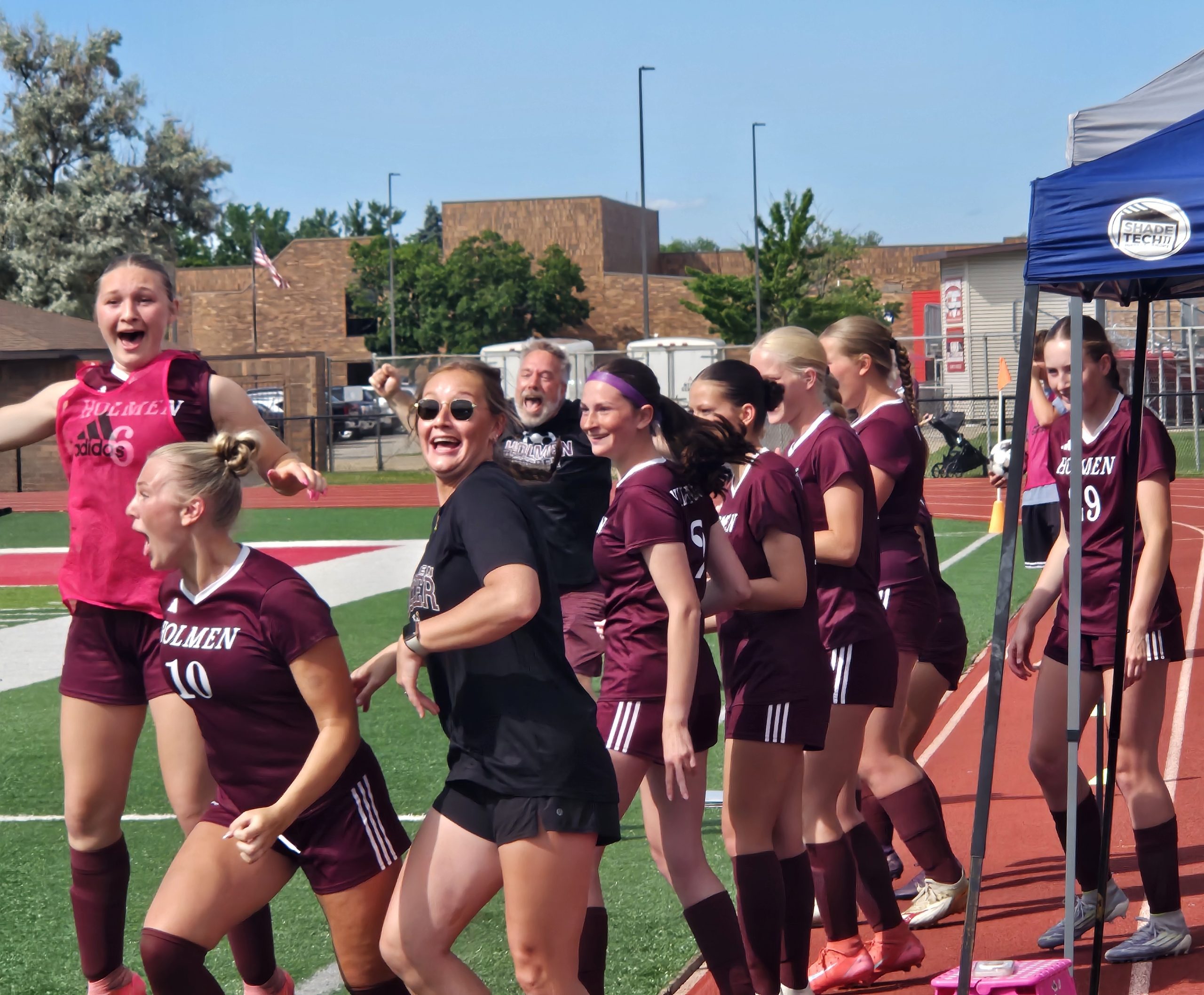 Holmen soccer players react as time expires and they become WIAA Division 2 sectional champions. -- TODD SOMMERFELDT PHOTO
